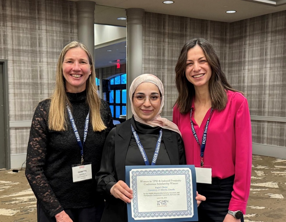 Raghd Obidat receiving her Women in TPD travel scholarship award